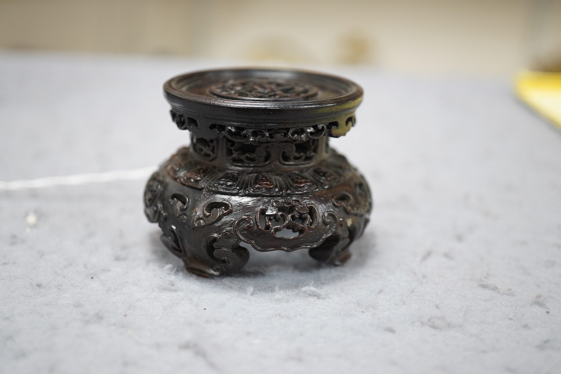 A Chinese huanghuali scholar’s stand, 18th/19th century, and a small reticulated zitan stand, 19th century